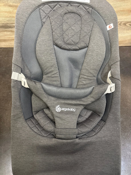 Front view of Ergobaby Evolve 3-in-1 Bouncer in Charcoal Grey showcasing padded seat, mesh panels, and harness