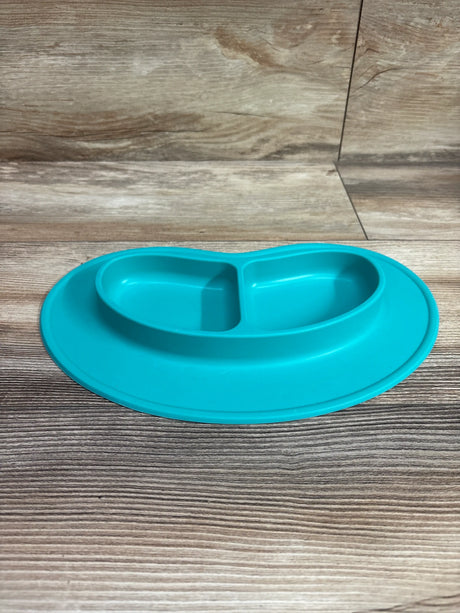 Front view of aqua blue Nuby Sure Grip Silicone Miracle Mat 2-Section Oval Plate showing two sections on wood-grain surface