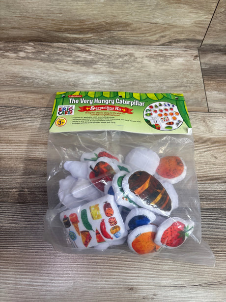 Front view of The Very Hungry Caterpillar Storytelling Kit showcasing felt story pieces in clear packaging on a wood surface
