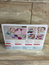 Rear of Fisher-Price Mini Me Moments DJ Gift Set box showing toy microphone, play records, and photos of babies on a wood floor