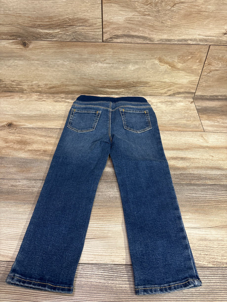 Back view of Old Navy Karate Skinny Drawstring Jeans in blue, size 3T, showing two back pockets on a wood floor