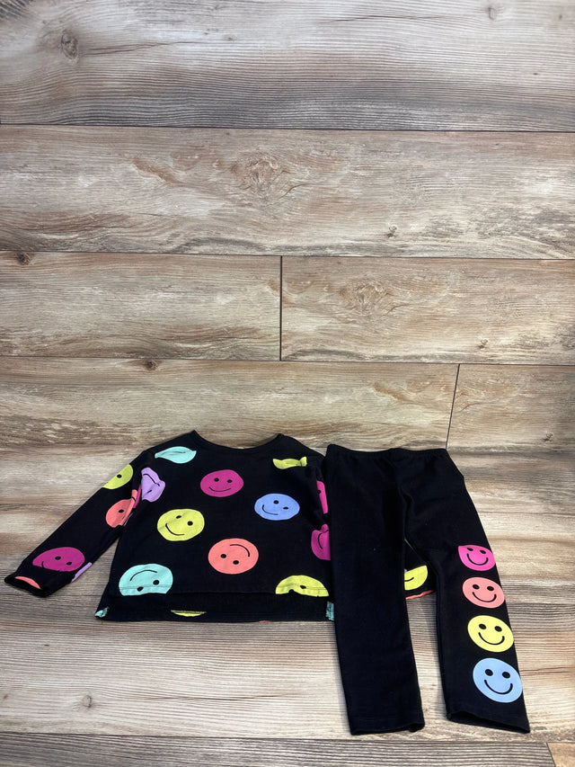 Flat lay of Children's Place 2pc Rainbow Happy Face Sweatshirt & Leggings Set Black sz 4T showcasing colorful smiley print on wood plank floor