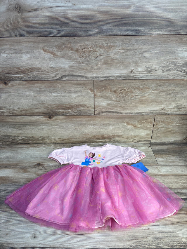 Flat lay of Ms Rachel pink puff-sleeve tulle dress size 2T showing layered tulle skirt and printed bodice on wood background