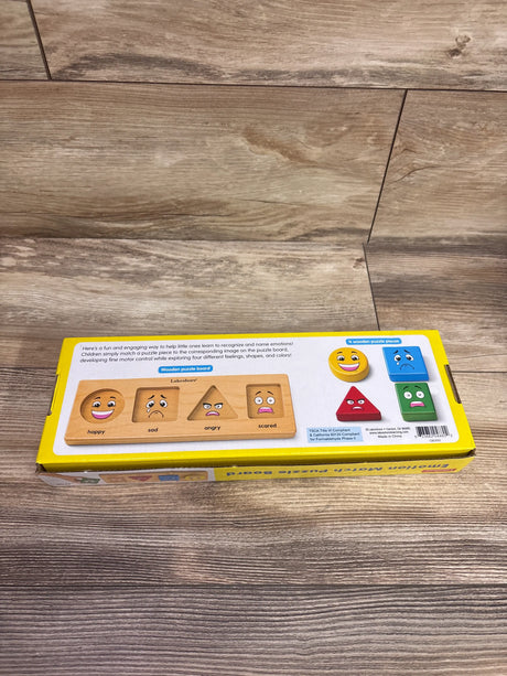 Lakeshore Emotion Match Puzzle Board with happy, sad, angry and scared faces plus four colored pieces on a wood floor