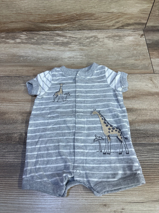 Flat lay of newborn grey striped romper showing front snap buttons, short sleeves, and giraffe prints on wood floor
