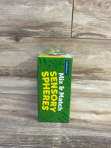 Side view of Lakeshore Mix & Match Sensory Spheres box showing product name text and Lakeshore logo on wood background