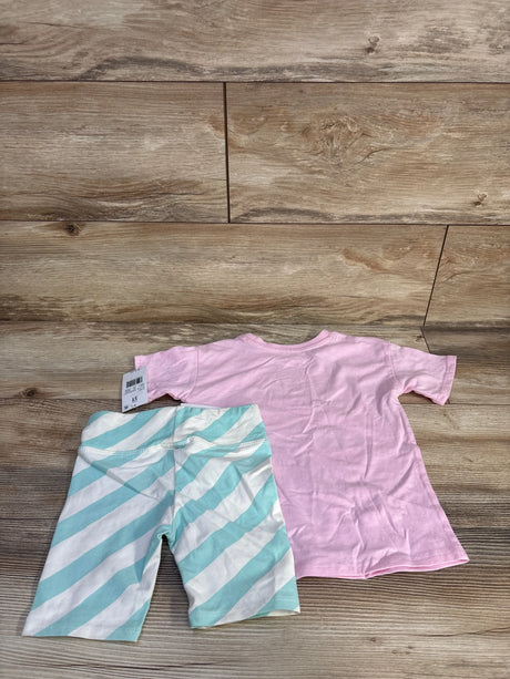 Flat lay of toddler two-piece showing pink T-shirt and mint-striped shorts on wood floor, size 3T tag visible