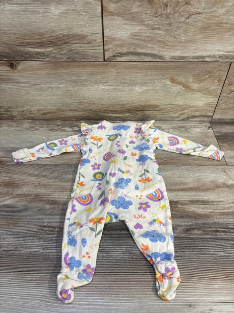 Flat-lay of Old Navy newborn 0-3M beige footed sleeper with rainbow and cloud print and ruffle shoulders on wood floor