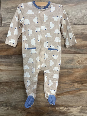 Beige baby onesie with white car prints, blue collar and footed legs on wooden floor