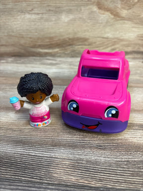 Front of Fisher-Price Little People pink convertible and small figure holding blue sippy cup on wood