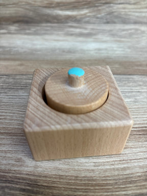 Wooden Montessori toy with blue knob on square base for toddler fine motor skills