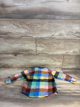 Back view of Old Navy 3T flannel button-up in multicolored check showing long sleeves and button cuffs on wood background