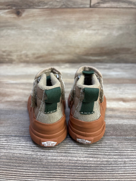 Rear view of Vans MTE Slip-On Hi Terrain V toddler sneakers size 5C showing green heel pull tabs, tan suede upper and gum rubber soles on wooden background