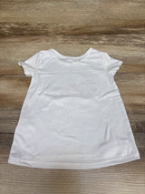 Back view of Btween unicorn shirt in white, size 2T, showcasing its short sleeves and plain back on a wood surface