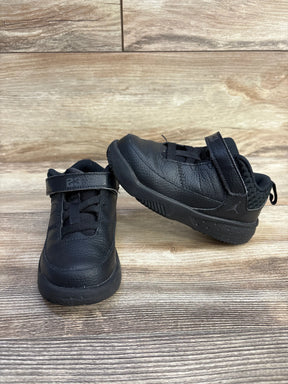 Three-quarter view of Jordan Max Aura 3 TD sneakers in Black Anthracite, textured leather with Velcro strap on wood floor