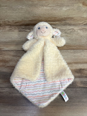 Plush lamb baby lovey security blanket with pastel patterned lining on wood background