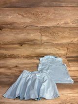 Laid-flat view of girls' light blue 2-piece tennis outfit (collared sleeveless top and flared skort) size 5T on wood floor