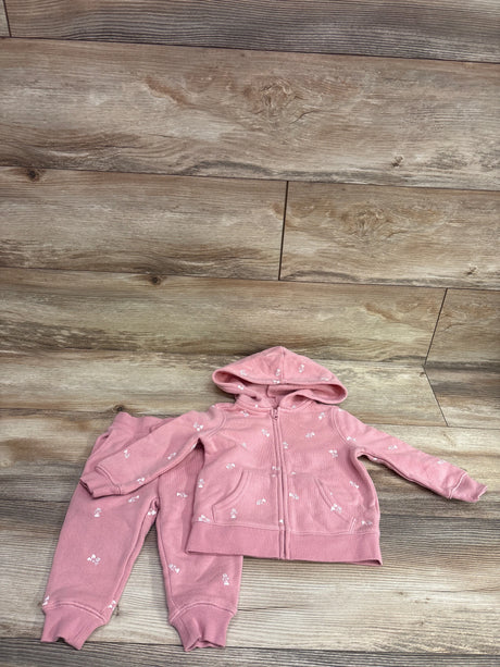 Oshkosh pink 2-piece baby set with full zip hooded jacket and matching pants on wood background