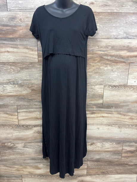 Front view of Smallshow black maternity nursing dress showcasing short sleeves and layered nursing panel against a wood plank background