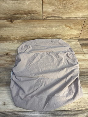 Wrinkled light gray fitted cotton sheet on wood floor background