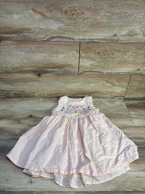 Flat lay of Max Studio pink toddler dress (4T) showing embroidered floral bodice and ruffled waist on wood background