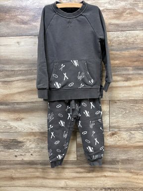 Dark gray toddler sweatshirt and pants with white ski and goggles print on wooden background