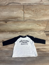 Moncler Archive kids' long sleeve shirt with black sleeves and white front on wooden floor