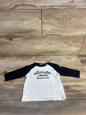 Moncler Archive kids' long sleeve shirt with black sleeves and white front on wooden floor