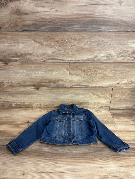 Front view of Children's Place blue toddler denim jacket size 5T showing button-front closure and chest pockets on wood background