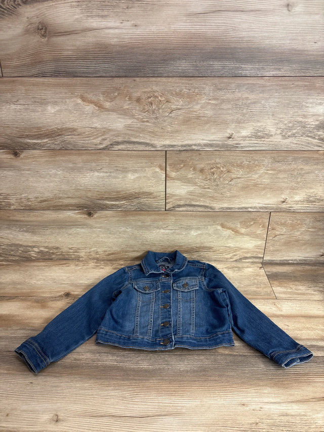 Front view of Children's Place blue toddler denim jacket size 5T showing button-front closure and chest pockets on wood background