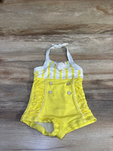 Top view of yellow Janie & Jack halter swimsuit with white striped top, front buttons, and ruched sides on wood surface