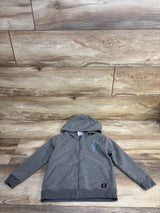 Gray kids' zip-up hoodie with lightning bolt patch on wood background, gently used clothing
