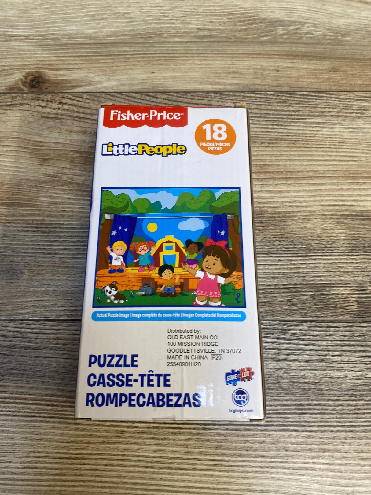 Fisher-Price Little People 18-piece puzzle box for kids on wood background