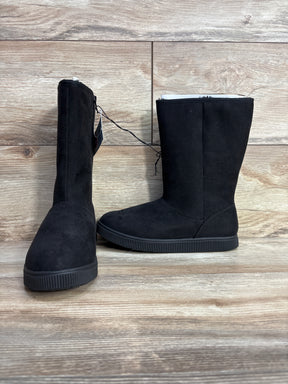 Black suede kids winter boots with rubber soles on wood floor