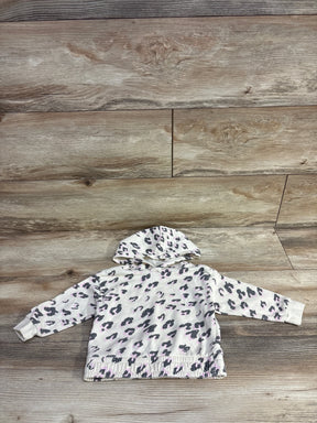 Toddler sized hooded sweatshirt with gray and pink leopard print on a wood floor background