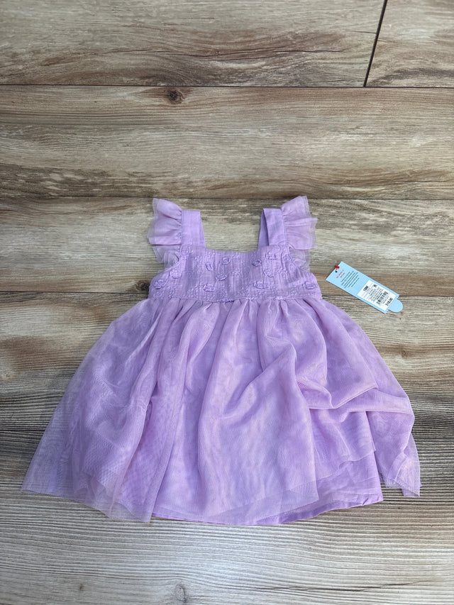 Light purple toddler dress with ruffled sleeves, displayed on wood background, resale kids clothes