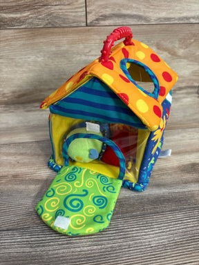 Colorful soft fabric toy house with handle, open door, and plush ball inside on wood floor
