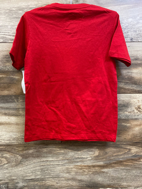 Back view of a red Tom and Jerry shirt in size 4 to 5T showing short sleeves on a wood surface