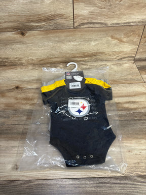Pittsburgh Steelers baby onesie in packaging on wood floor, NFL infant apparel
