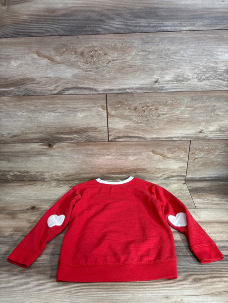 Back view of Cat and Jack red pullover sweatshirt 5T showing white heart elbow patches and white neckline trim on wood floor