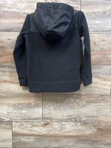 Back view of Nike Sportswear black full-zip fleece jacket in size 4-5T showcasing hood and fleece texture on wood flooring