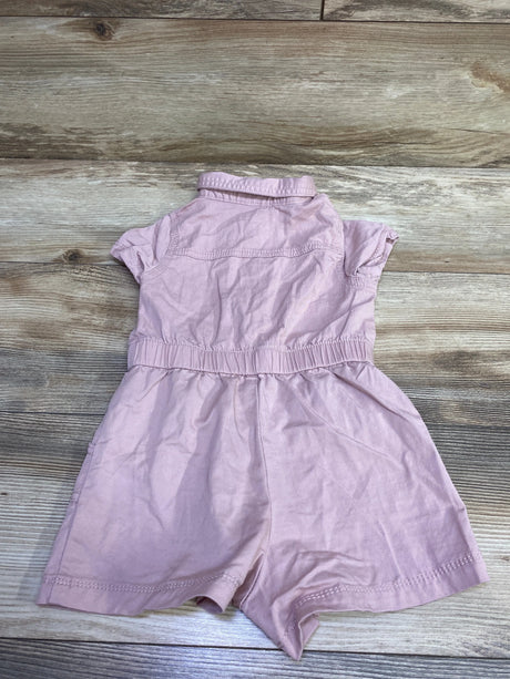 Back view of Cat & Jack pink utility romper in size 3T showcasing short sleeves and elastic waist with a wood floor background