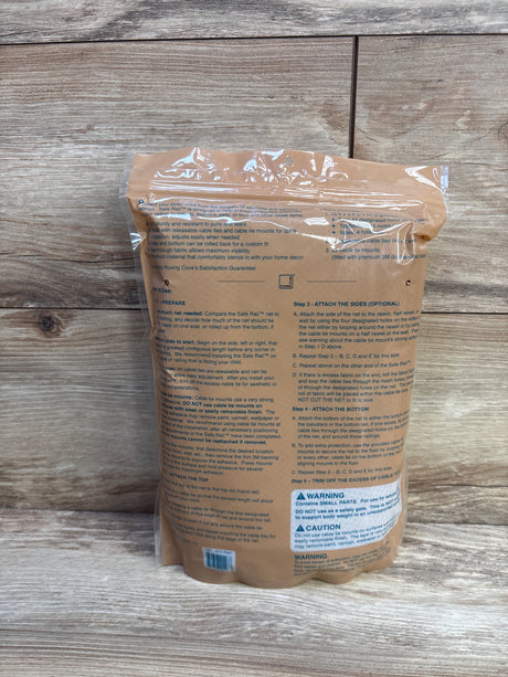 Rear view of Roving Cove stair banister guard safety net (10 ft x 3 ft) packaging showing printed installation instructions and warning label on wooden background