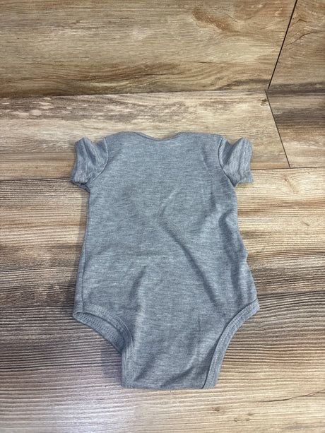 Flat lay of grey Sprout Joy Lil Nugget baby bodysuit showing short sleeves and heather knit on wood background