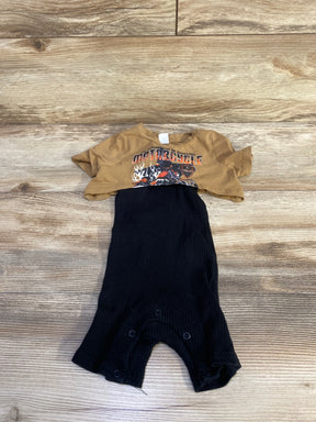 Flat lay of two-piece baby set brown cropped motorcycle tee and black ribbed romper with snap crotch on wood background