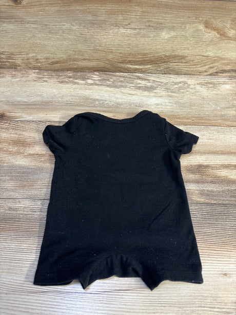 Back view of Shein Just A Boy Who Loves His Mom shortie romper showcasing short sleeves on wood grain