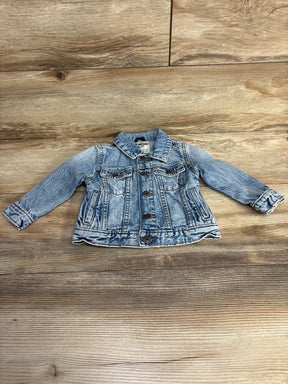 Light blue OshKosh B'gosh toddler denim jacket with buttons on wooden background