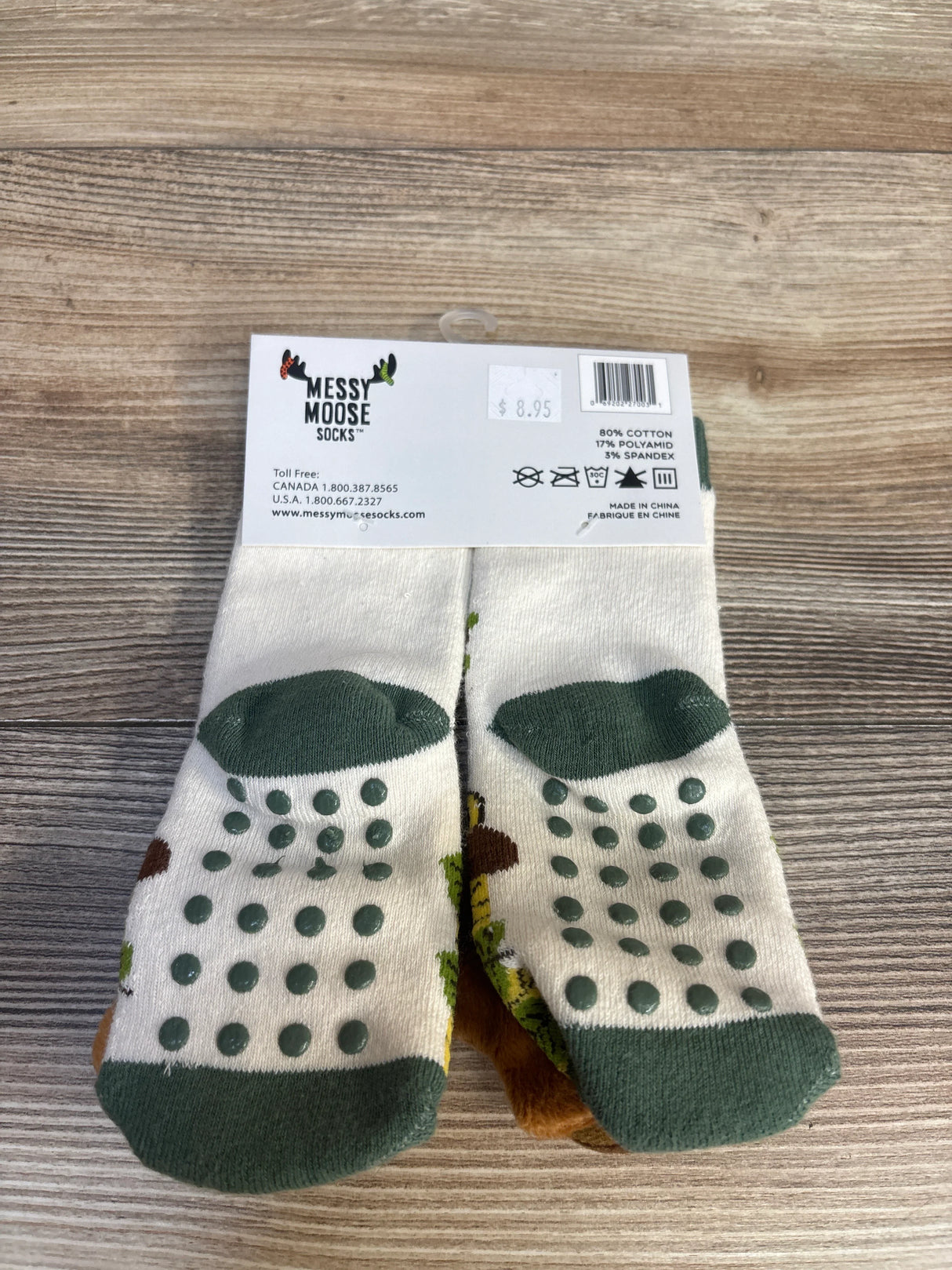 Messy Moose toddler grip socks with green dots, non-slip soles, perfect for baby and kids' safety on wood floors