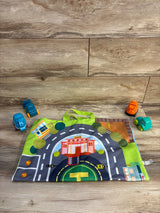 Top-down view of Alasou 5pc baby crane and car set with playmat showing road and helipad and four toy vehicles on wood floor
