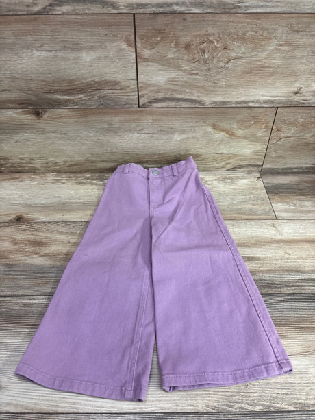 Lavender wide-leg pants for toddlers by Me n Mommy To Be on a wooden background.